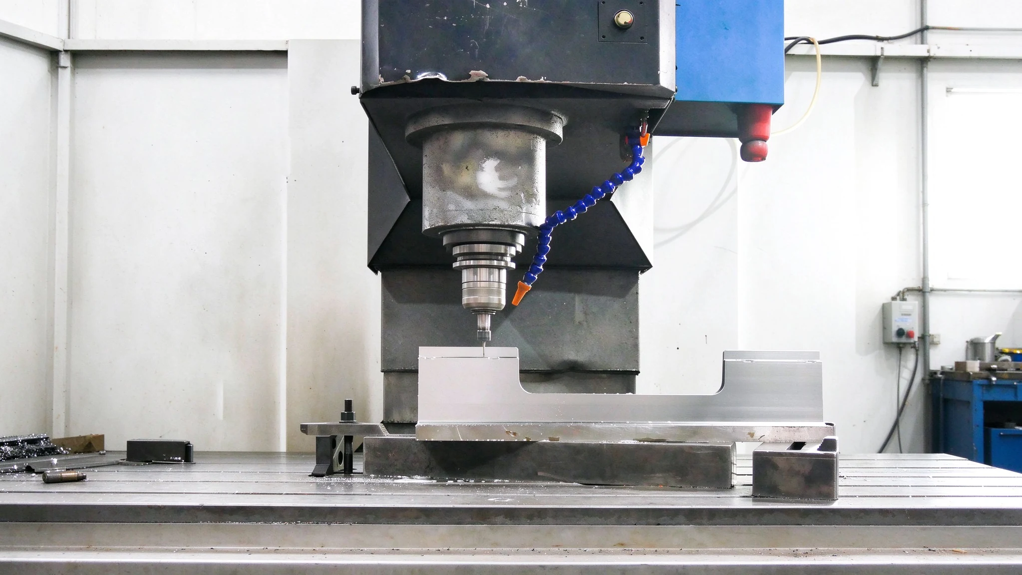 Milling machine machining a metal mold component